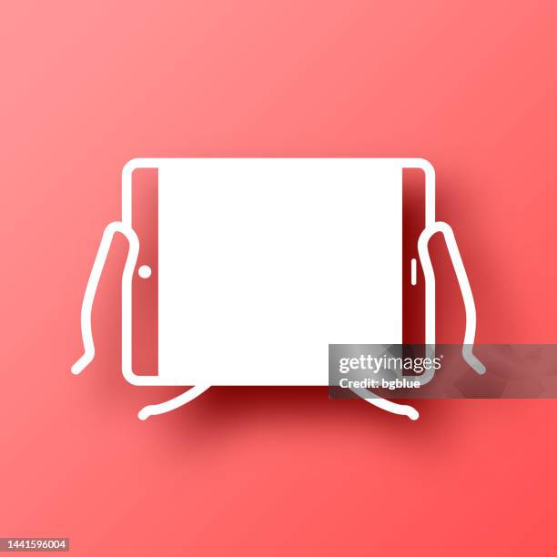hands holding tablet pc. icon on red background with shadow - using tablet blank screen stock illustrations