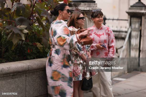 Fashion week guest's seen wearing colorful looks with a Loewe puzzle bag and prada cleo bag, outside Halpern Show during London Fashion Week, on...