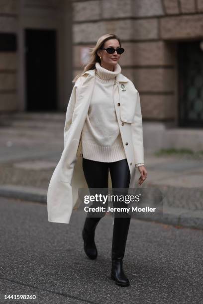 Mandy Bork wearing Chanel black leather boots, Chanel black round shades, Wolford black leather leggings, Hermes beige coat and Hermes beige leather...