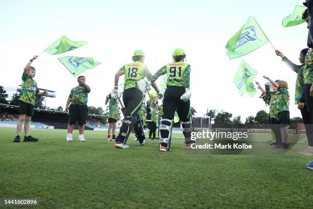 Phoebe Litchfield and Tammy Beaumont of the Thunder take the field during the Women's Big Bash League match between the Sydney Thunder and the...