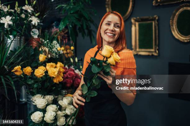 flower shop worker - florist arranging stock pictures, royalty-free photos & images