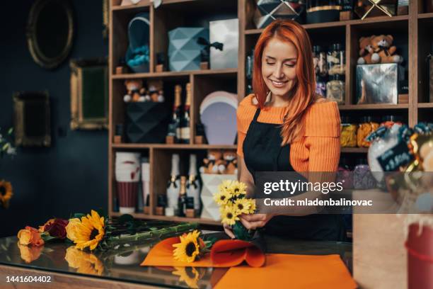 flower shop worker - gift shop interior stock pictures, royalty-free photos & images