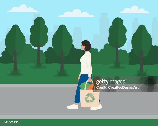 stockillustraties, clipart, cartoons en iconen met side view of walking woman carrying recycled shopping bag with fresh food. environmental protection, zero waste and sustainability concepts - duurzame levensstijl