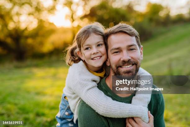 little daughter hugging her father. concept of parents love and relationships. - fathers day stock pictures, royalty-free photos & images