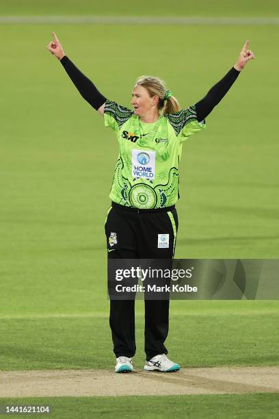 Sammy-Jo Johnson of the Thunder celebrates taking the wicket of Chamari Athapaththu of the Renegades during the Women's Big Bash League match between...