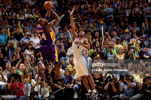Kobe Bryant of the Los Angeles Lakers scores against Arron Afflalo of the Denver Nuggets in Game Six of the Western Conference Quarterfinals in the...