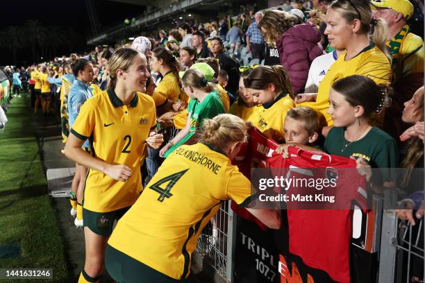 Courtney Nevin and Clare Polkinghorne of the Matildas interact with fans after the International Friendly match between the Australia Matildas and...