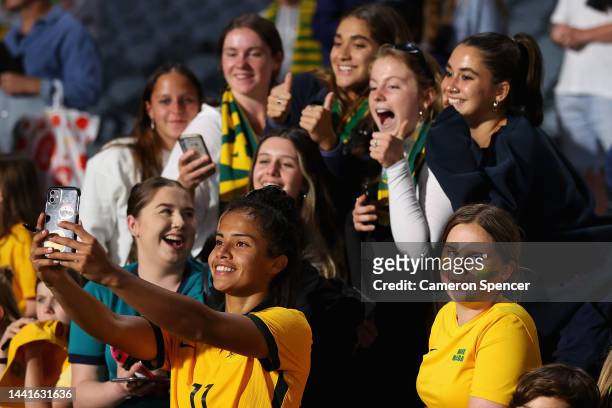 Mary Fowler of the Matildas poses with fans during the International Friendly match between the Australia Matildas and Thailand at Central Coast...