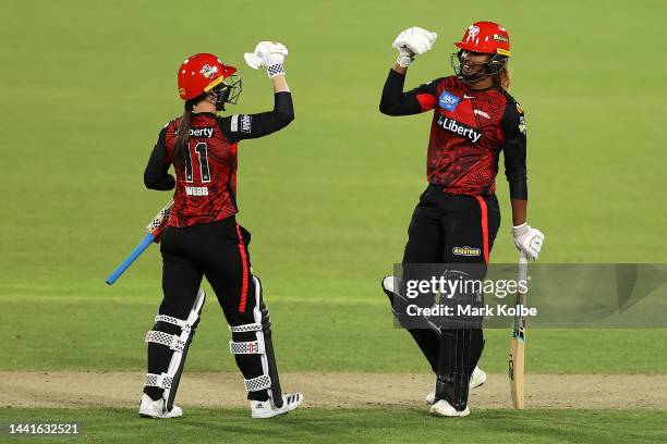 Courtney Webb and Hayley Matthews of the Renegades celebrate victory during the Women's Big Bash League match between the Sydney Thunder and the...