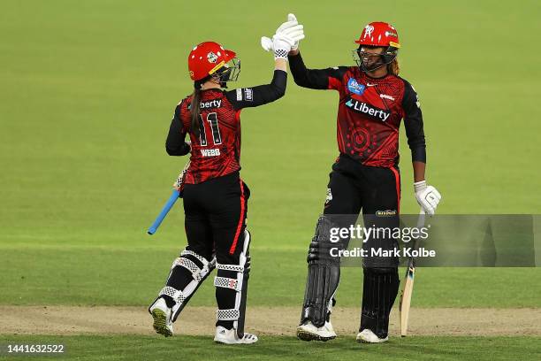 Courtney Webb and Hayley Matthews of the Renegades celebrate victory during the Women's Big Bash League match between the Sydney Thunder and the...