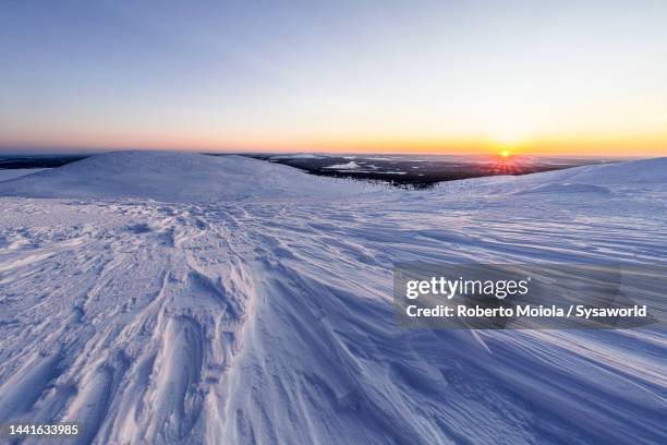 frozen snowy mountains at dusk, finnish lapland - terrain stock pictures, royalty-free photos & images