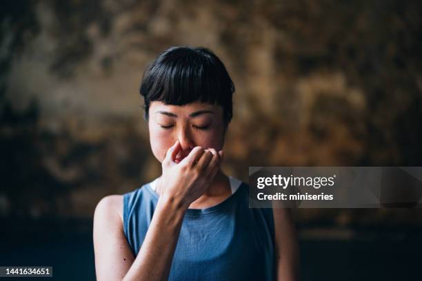 beautiful woman meditating - pranayama stock pictures, royalty-free photos & images