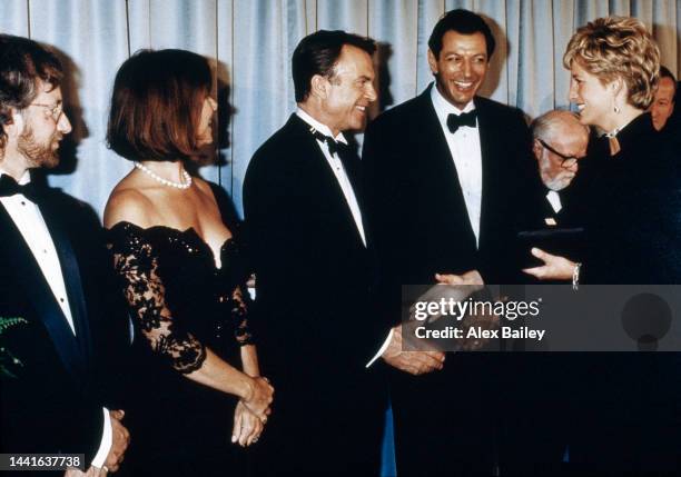 Princess Diana, at the Premiere of Jurassic Park, meets the film director Steven Spielberg, the actress Kate Capshaw, and the actors Sam Neill, Jeff...