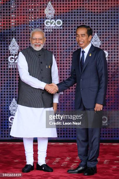 Prime Minister Narendra Modi of India is greeted by the President of the Indonesian Republic Joko Widodo during the formal welcome ceremony to mark...