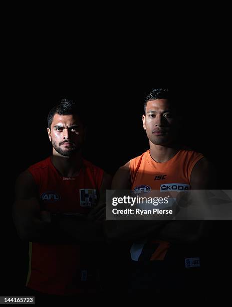 Karmichael Hunt of the Suns and Israel Folau of the Giants pose ahead of tomorrow's first AFL match between the Greater Western Sydney Giants and the...