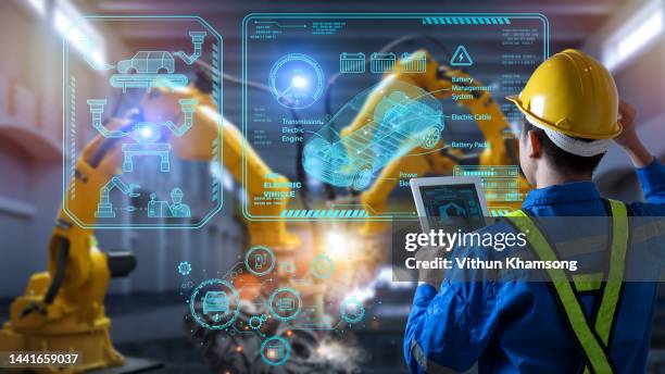 engineer control robotics automatic arms machine welding electric vehicle car at factory. - computer aided manufacturing stock pictures, royalty-free photos & images