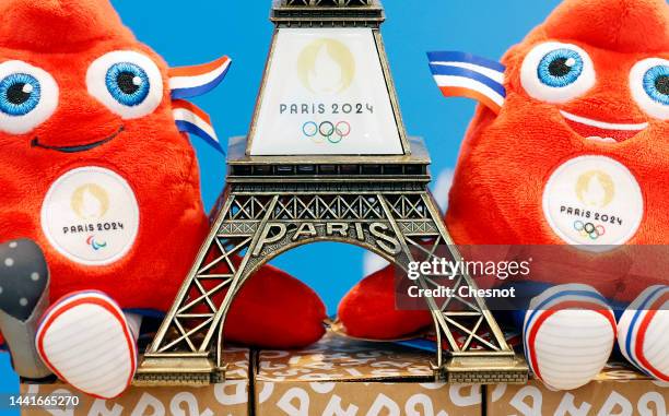 Replica of the Eiffel Tower with the logo of the 2024 Olympic Games surrounded by official mascots for the Paris 2024 Summer Olympic and Paralympic...