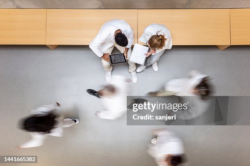 Scientists walking in the corridor Scientists walking in the corridor