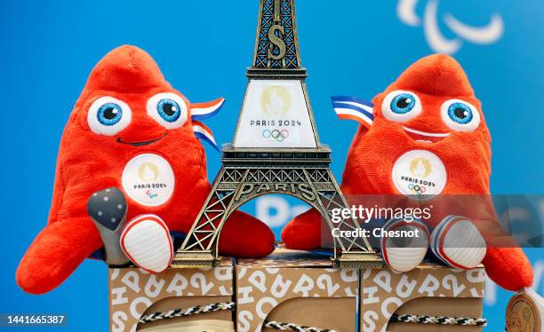 Replica of the Eiffel Tower with the logo of the 2024 Olympic Games surrounded by official mascots for the Paris 2024 Summer Olympic and Paralympic...