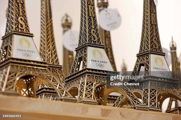 Replicas of the Eiffel Tower with the logo of the 2024 Olympic Games for the Paris 2024 Summer Olympic and Paralympic Games are displayed inside the...