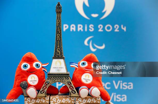 Replica of the Eiffel Tower with the logo of the 2024 Olympic Games surrounded by official mascots for the Paris 2024 Summer Olympic and Paralympic...