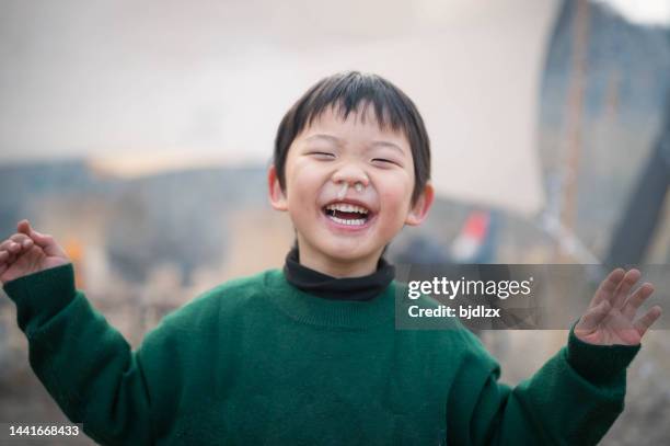 a cute boy with a runny nose - human nose stockfoto's en -beelden