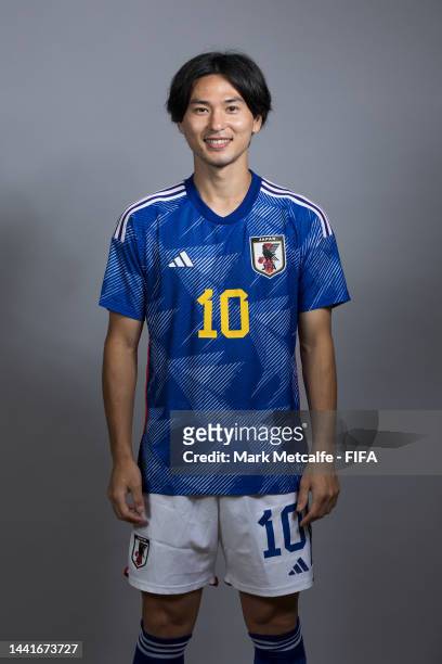 Takumi Minamino of Japan poses for a portrait during the official FIFA World Cup Qatar 2022 portrait session on November 15, 2022 in Doha, Qatar.