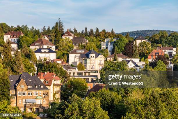 germany, baden-wurttemberg, baden-baden, houses and villas of hillside town in black forest range - baden baden fotografías e imágenes de stock