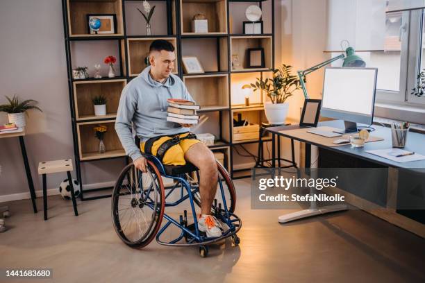 man with books - orthopedic equipment stock pictures, royalty-free photos & images