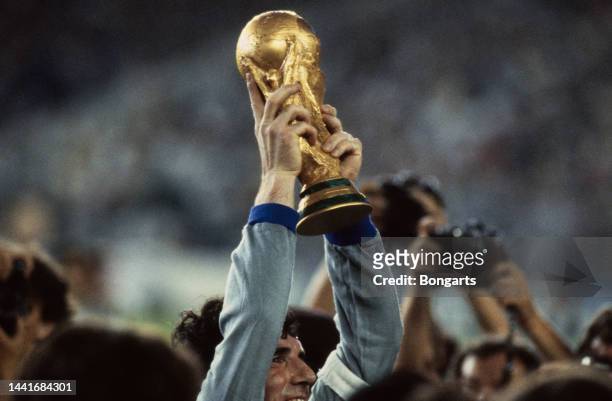 Italian goalkeeper Dino Zoff lifts the FIFA World Cup Trophy following the final of the 1982 FIFA World Cup, held at the Santiago Bernabeu in Madrid,...