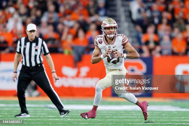 Jordan Travis of the Florida State Seminoles attempts a pass against the Syracuse Orange at JMA Wireless Dome on November 12, 2022 in Syracuse, New...
