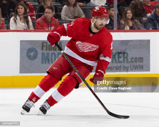 Filip Zadina of the Detroit Red Wings turns up ice against the New York Islanders during the third period of an NHL game at Little Caesars Arena on...