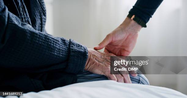 senior hands, care touch in closeup and empathy, comfort and love in home care and console. support help, hand together with family friends for retirement patient in hospital, clinic or nursing home - 老人醫學 個照片及圖片檔