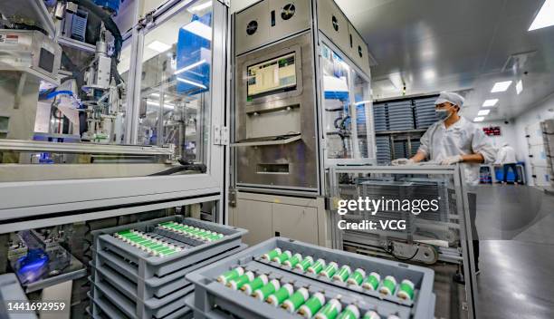 Employees work on the production line of lithium battery at a factory on November 15, 2022 in Xinyu, Jiangxi Province of China.