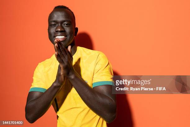 Awer Mabil of Australia poses during the official FIFA World Cup Qatar 2022 portrait session on November 15, 2022 in Doha, Qatar.