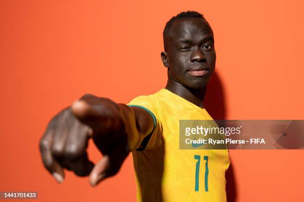 Awer Mabil of Australia poses during the official FIFA World Cup Qatar 2022 portrait session on November 15, 2022 in Doha, Qatar.