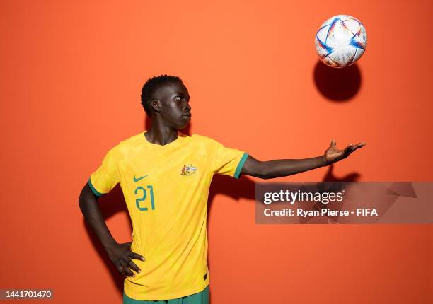 Garang Kuol of Australia poses during the official FIFA World Cup Qatar 2022 portrait session on November 15, 2022 in Doha, Qatar.