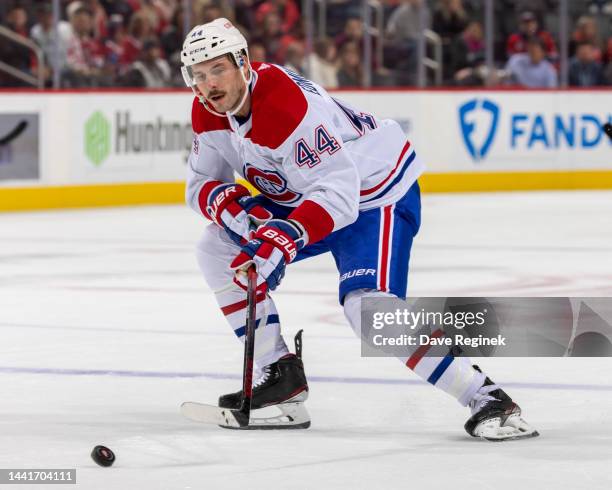 Joel Edmundson of the Montreal Canadiens skates after a loose puck against the Detroit Red Wings during the first period an NHL game at Little...