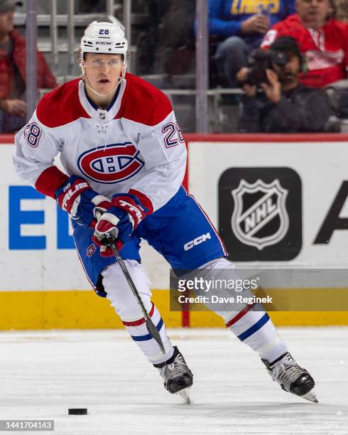 Christian Dvorak of the Montreal Canadiens skates up ice with the puck against the Detroit Red Wings during the second period an NHL game at Little...