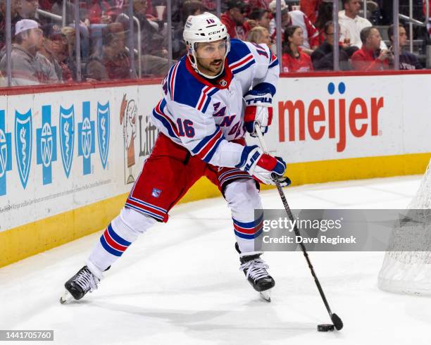 Vincent Trocheck of the New York Rangers stops behind the net with the puck against the Detroit Red Wings during the first period of an NHL game at...