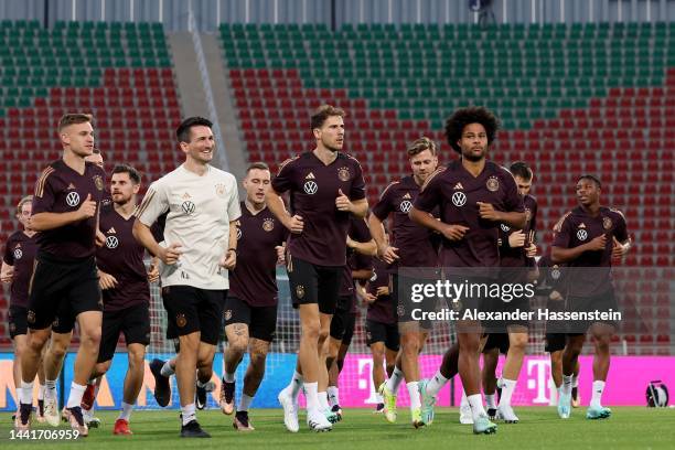 Players of Germany run during the Germany training session at Sultan Qaboos Sports Complex on November 15, 2022 in Muscat, Oman.