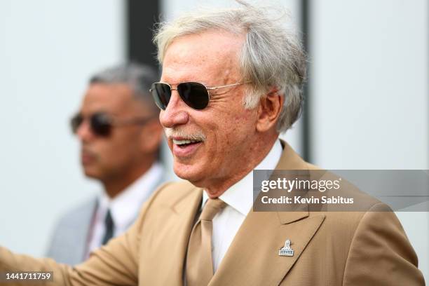 Owner Stan Kroenke of the Los Angeles Rams smiles and waves to fans in the tunnel prior to an NFL football game against the Tampa Bay Buccaneers at...