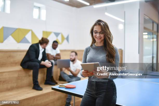 business team having a meeting in table tennis room - university debate stock pictures, royalty-free photos & images