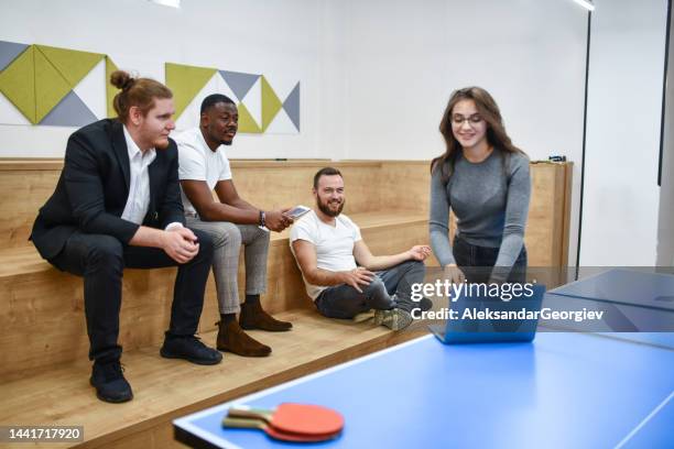 business team having a meeting in table tennis room - university debate stock pictures, royalty-free photos & images