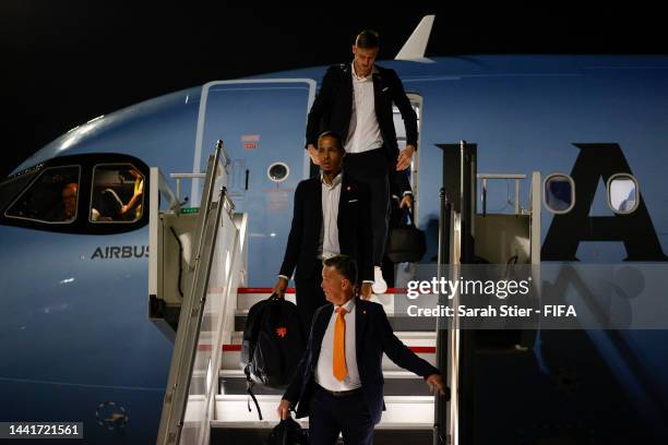 Louis van Gaal, Head Coach of Netherlands and Virgil Van Dijk disembark an aircraft upon arrival prior to the FIFA World Cup Qatar 2022 at Hamad...