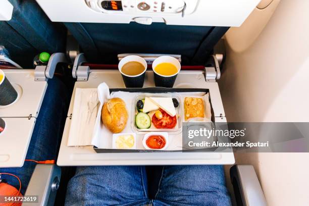 airplane food served during the flight, personal perspective view - airplane tray stock pictures, royalty-free photos & images