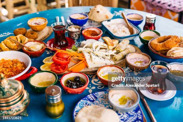 traditional turkish breakfast served in a restaurant - griekse gerechten stockfoto's en -beelden