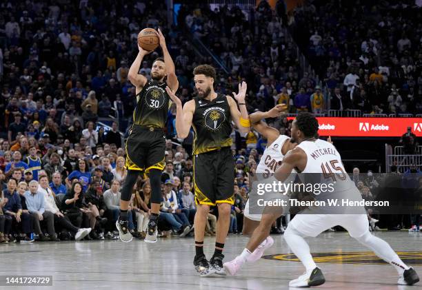 Stephen Curry of the Golden State Warriors shoots and makes a three-point shot against the Cleveland Cavaliers in the fourth quarter of an NBA...