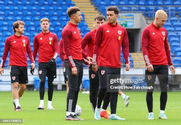 Brennan Johnoson of Wales talks to Ethan Ampadu as they take part in the final Wales FA training session before the depart for Qatar the world cup at...