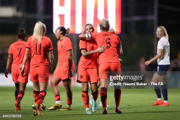 Rachel Daly of England celebrates with Millie Bright and teammates after scoring their team's first goal during the International Friendly between...